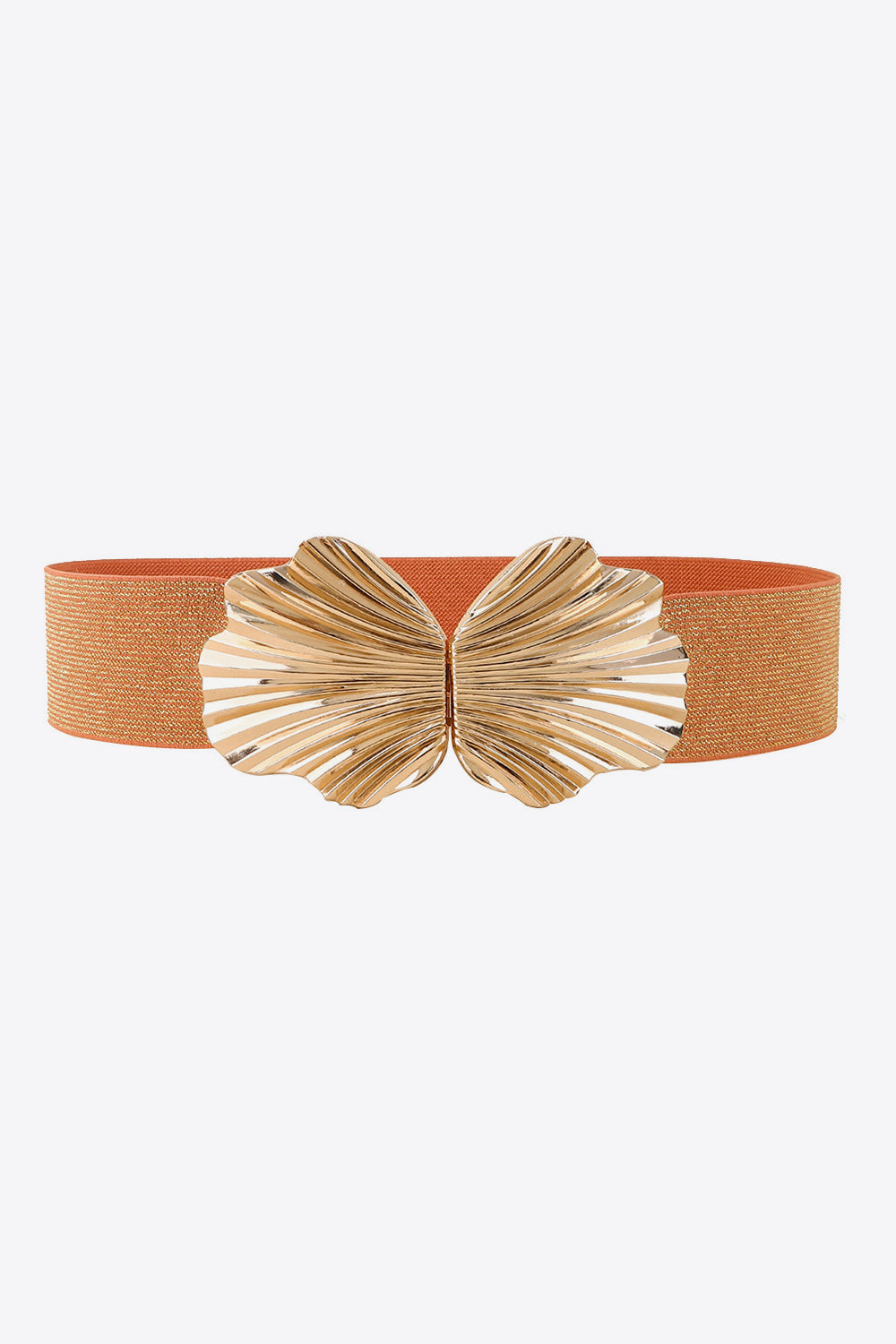 Burnt orange elastic belt with a polished gold-tone zinc alloy buckle featuring a sculptural butterfly-inspired silhouette and fan-like detailing.