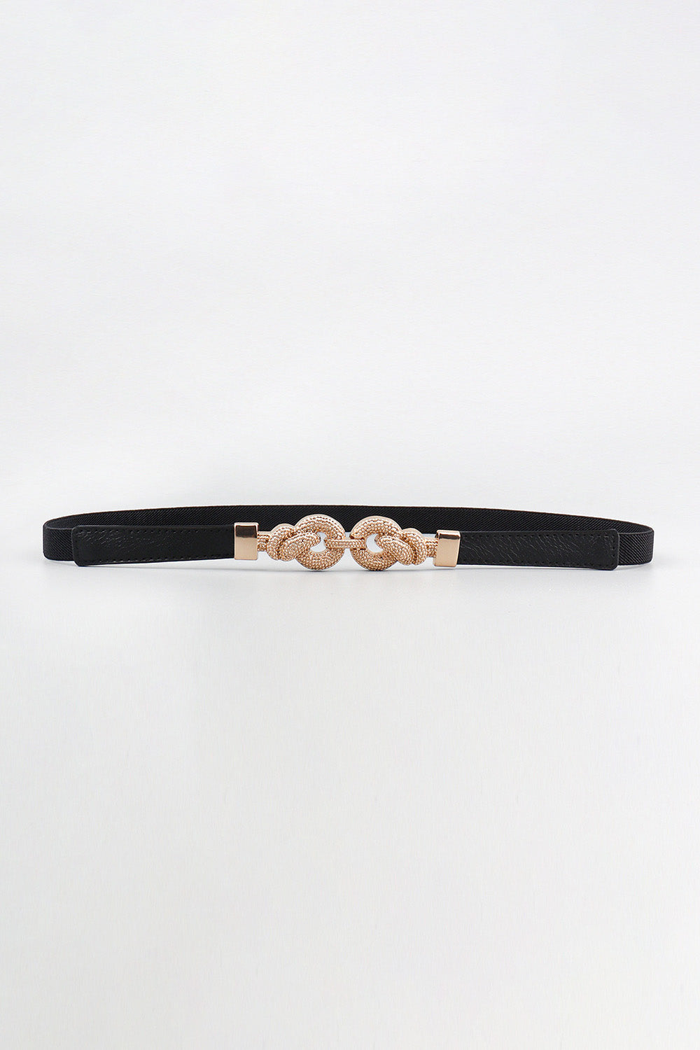 Slim black PU leather belt with a polished zinc alloy buckle featuring ornate interlocking rounded details and a sleek, streamlined silhouette.