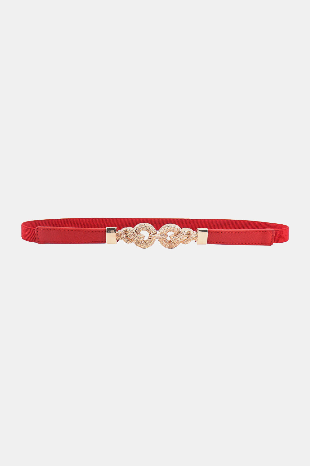 Slim red PU leather belt with a sleek silhouette, stitched construction, and an ornate zinc alloy buckle featuring rounded interlocking details.