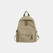Large khaki cotton backpack with a streamlined silhouette, zip-top closure, front zip pocket, side pockets, adjustable shoulder straps, and top handle.