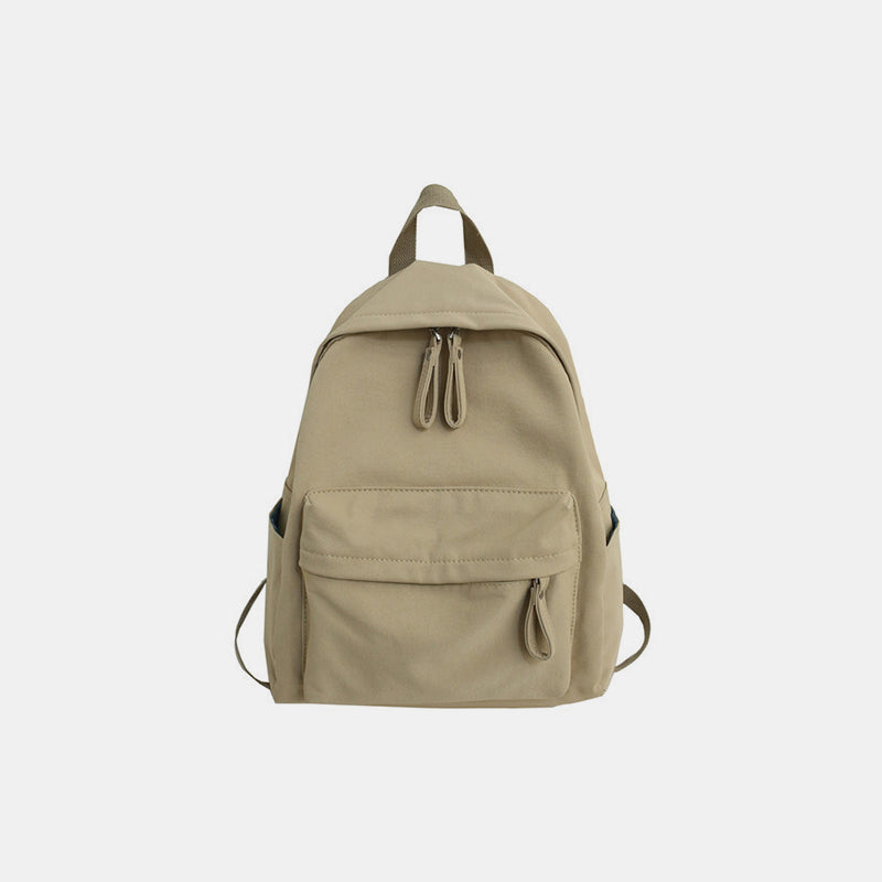 Large khaki cotton backpack with a streamlined silhouette, zip-top closure, front zip pocket, side pockets, adjustable shoulder straps, and top handle.