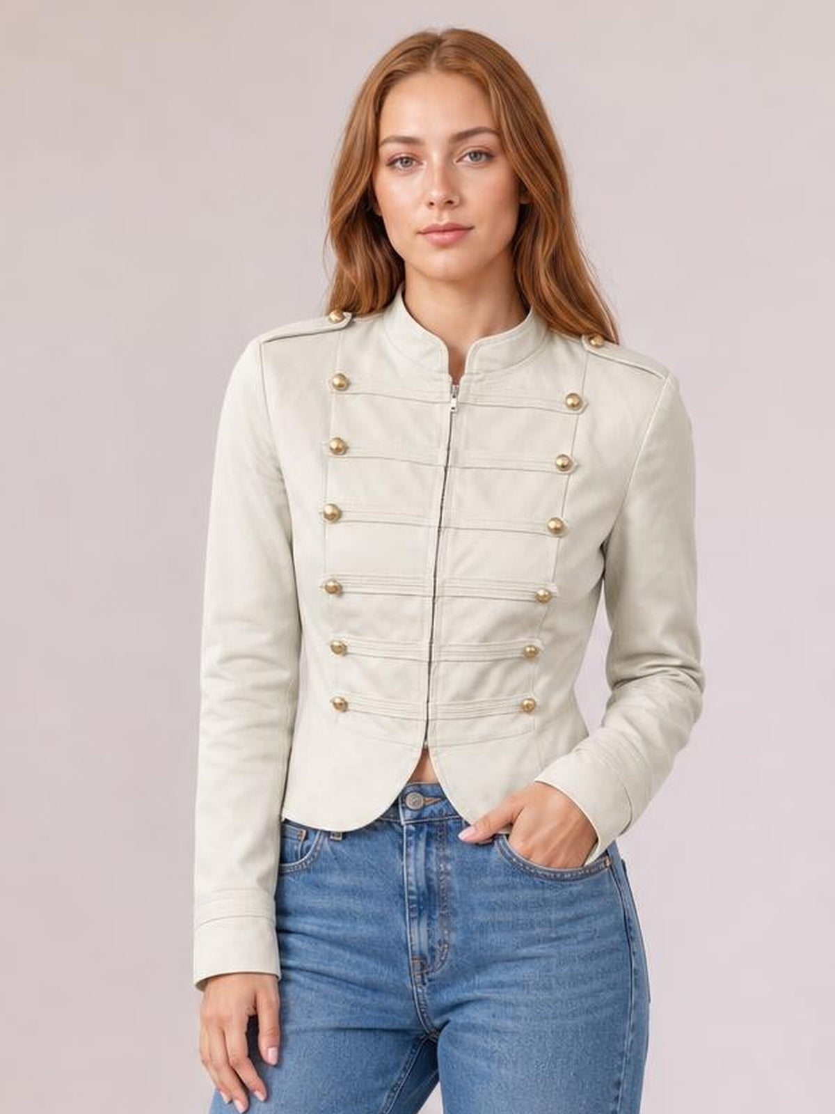 A model wears a cream cropped jacket with a stand collar, zip front, gold-tone buttons, horizontal seam detailing, long sleeves, and a fitted silhouette.