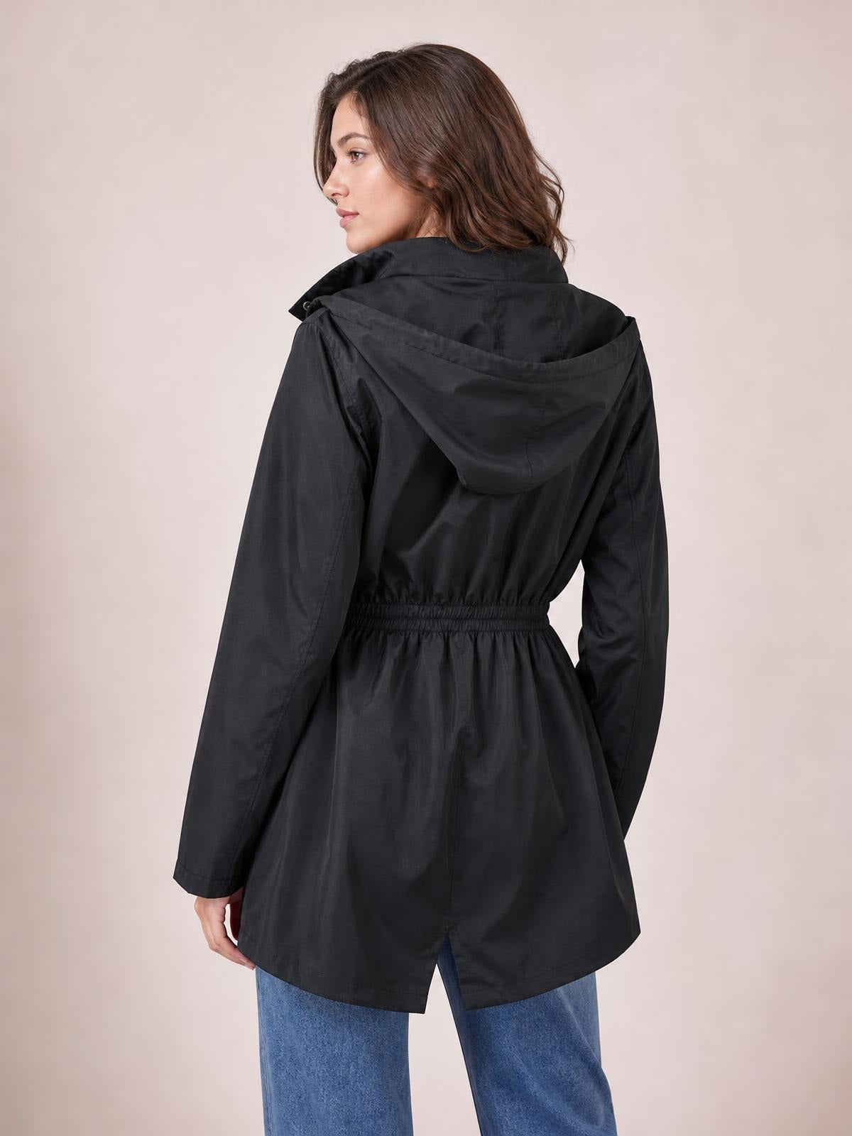 Model turned to show the back of a black hooded jacket with long sleeves, a drawstring waist, lined construction, and a relaxed regular-fit silhouette.
