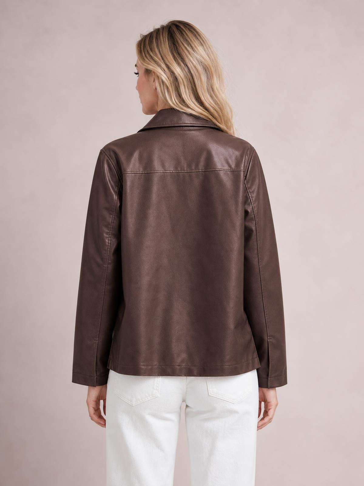 Model shown from behind wearing a brown leather-look zip-up jacket with a pointed collar, long sleeves, stitched back panel, and relaxed straight silhouette.