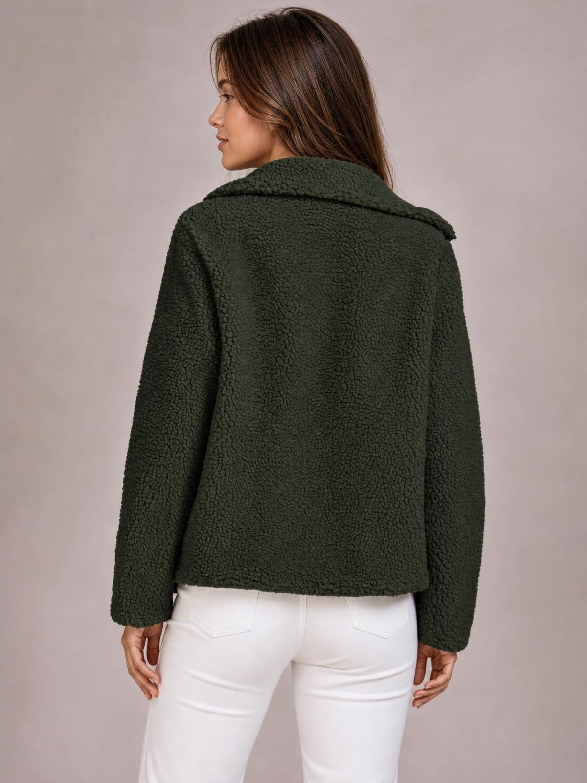 Model turned to the side and back wearing a dark green plush jacket with long sleeves, a wide collar, relaxed silhouette, and straight hem.