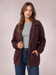 Model wears a burgundy zip-up jacket with a wide collar, long sleeves, metal zipper, ribbed cuffs and hem, and roomy front pockets.
